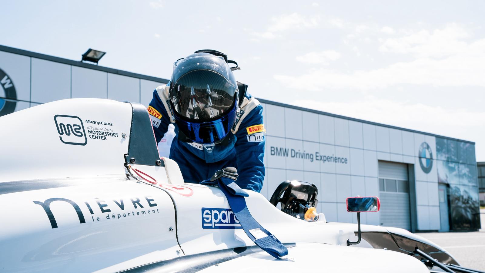 Climbing into F4 single-seater at Magny-Cours